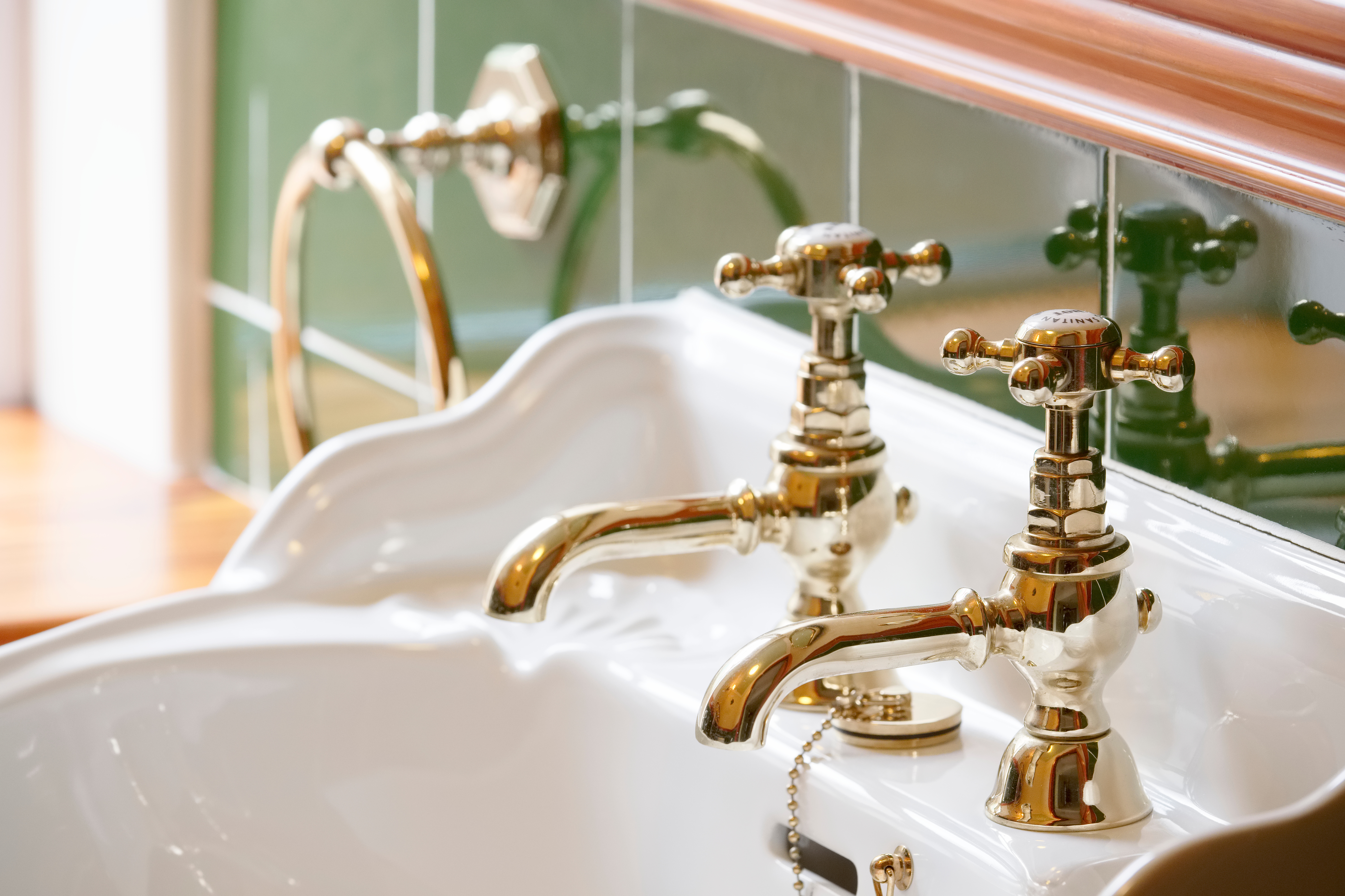 Historic porcelain sink with brass fixtures